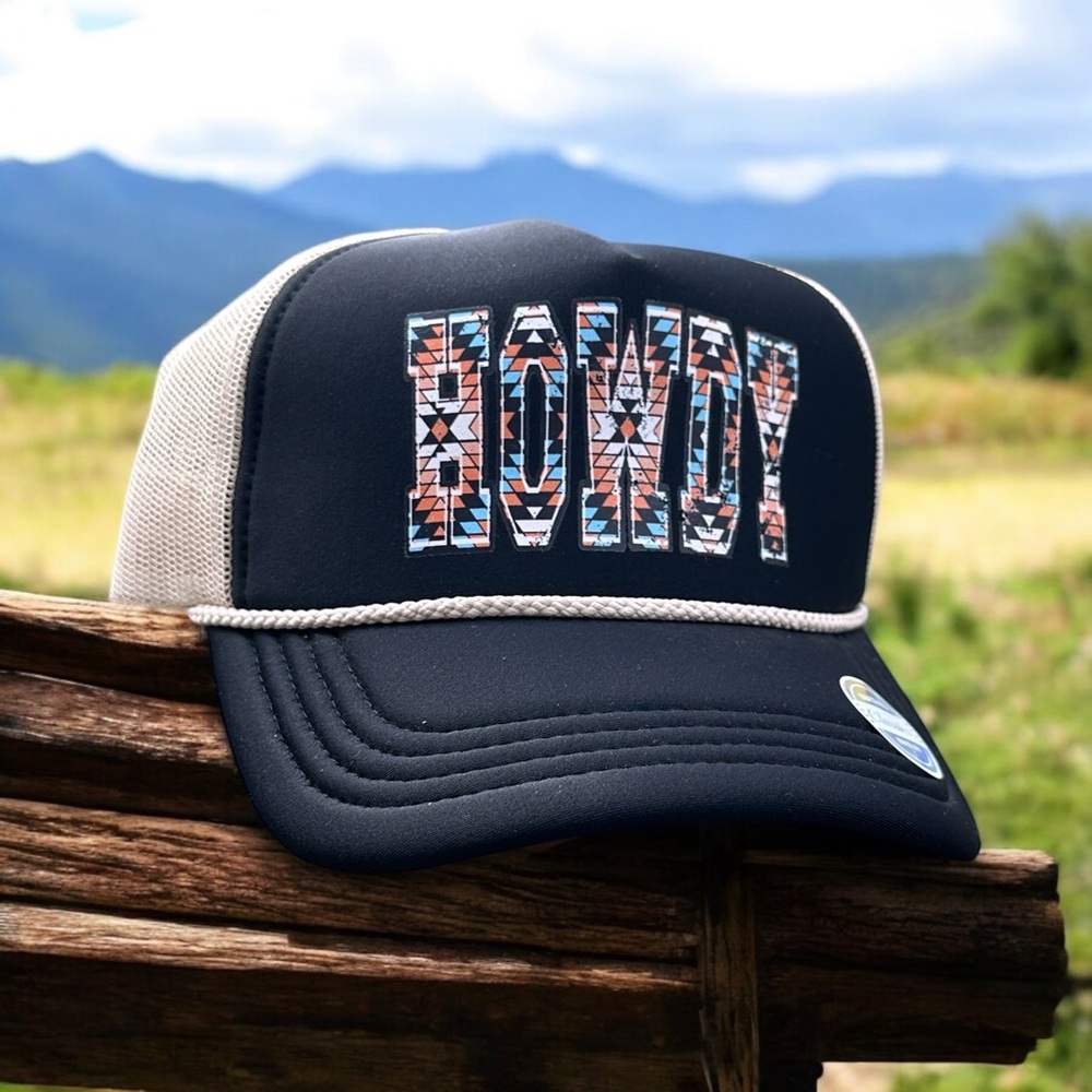 Low profile, black and ivory mesh trucker hat with a southwest HOWDY design